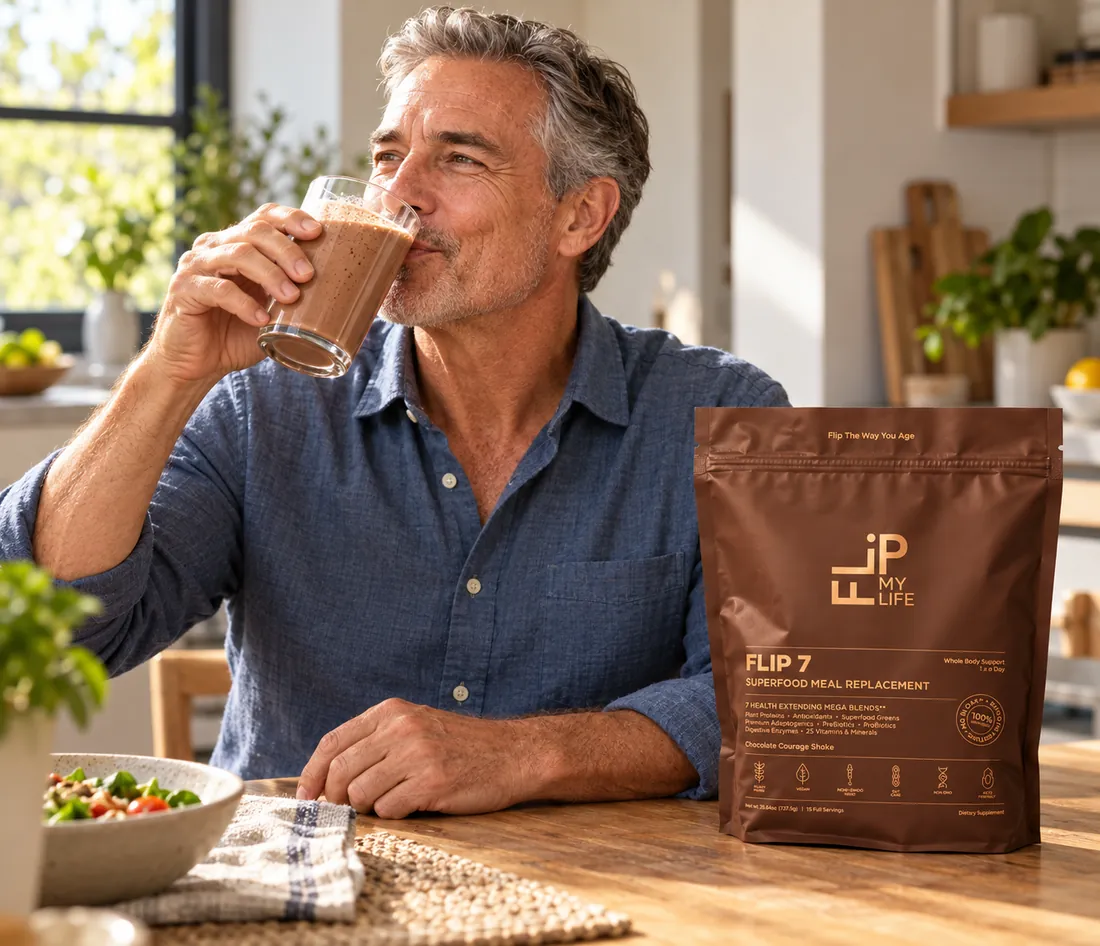 A man drinking a FLIP 7 shake at his kitchen table